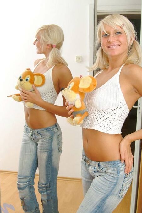 Wow just look at how cute this teen is she is smothering her teddy bear just bei