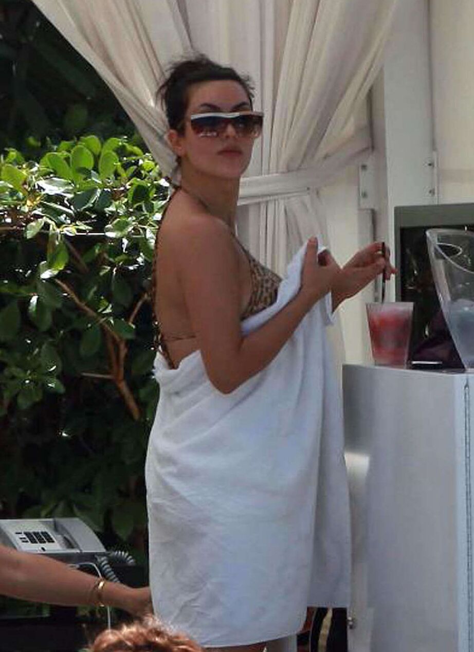 Kim Kardashian exposing her sexy body and huge boobs in bikini on pool