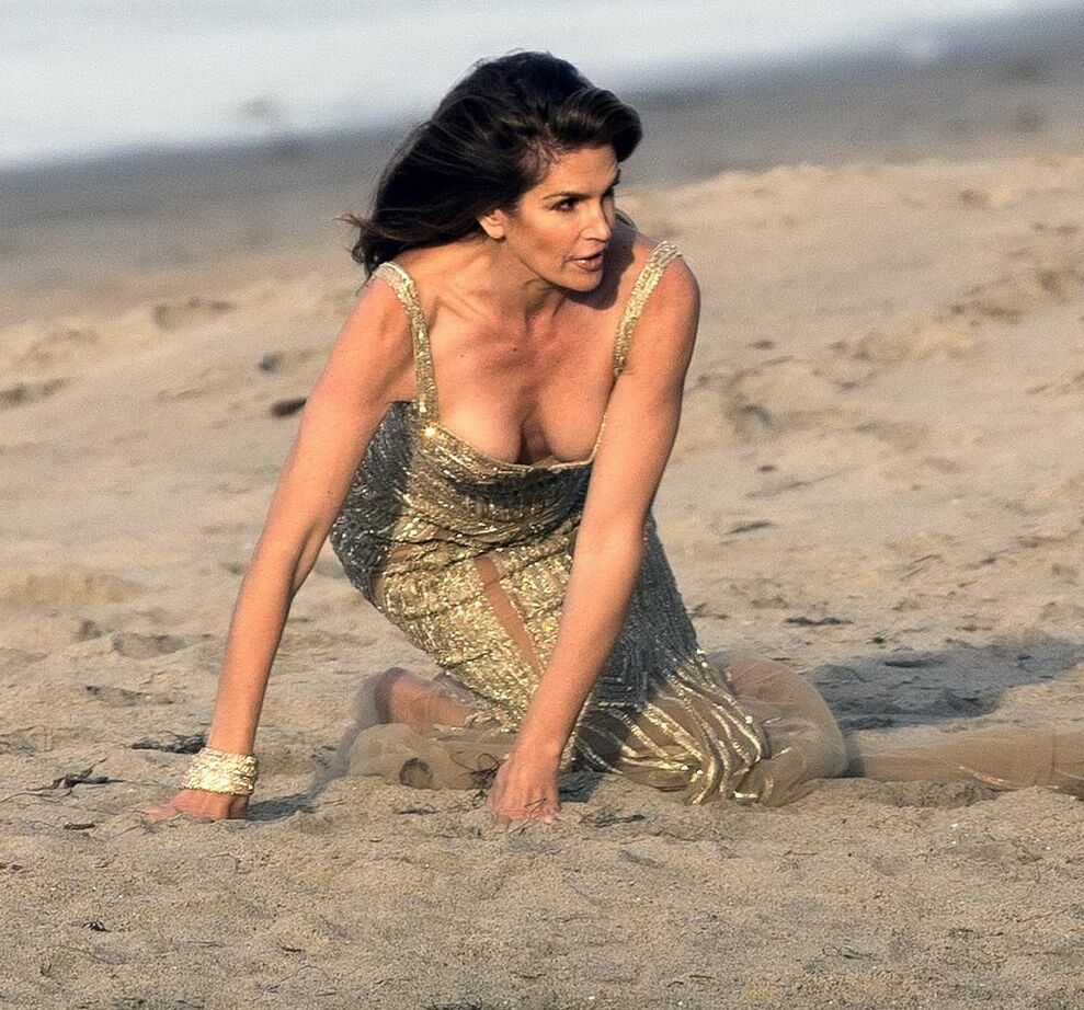 Cindy Crawford braless wearing a see through dress at the photoshoot in Malibu
