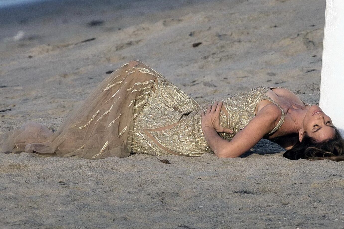 Cindy Crawford braless wearing a see through dress at the photoshoot in Malibu