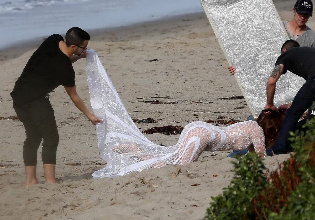 Cindy Crawford braless wearing a see through dress at the photoshoot in Malibu