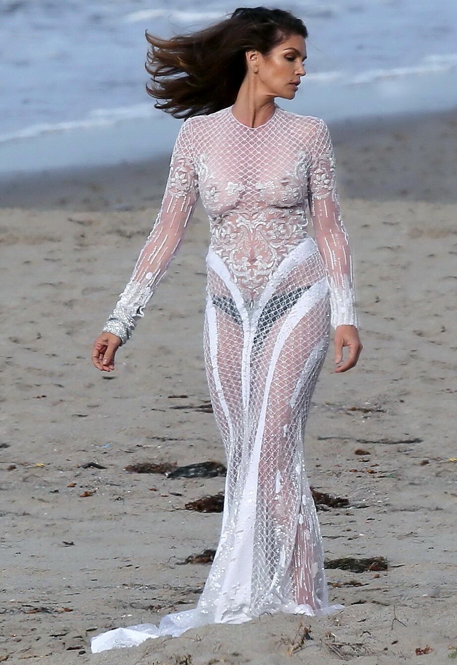Cindy Crawford braless wearing a see through dress at the photoshoot in Malibu