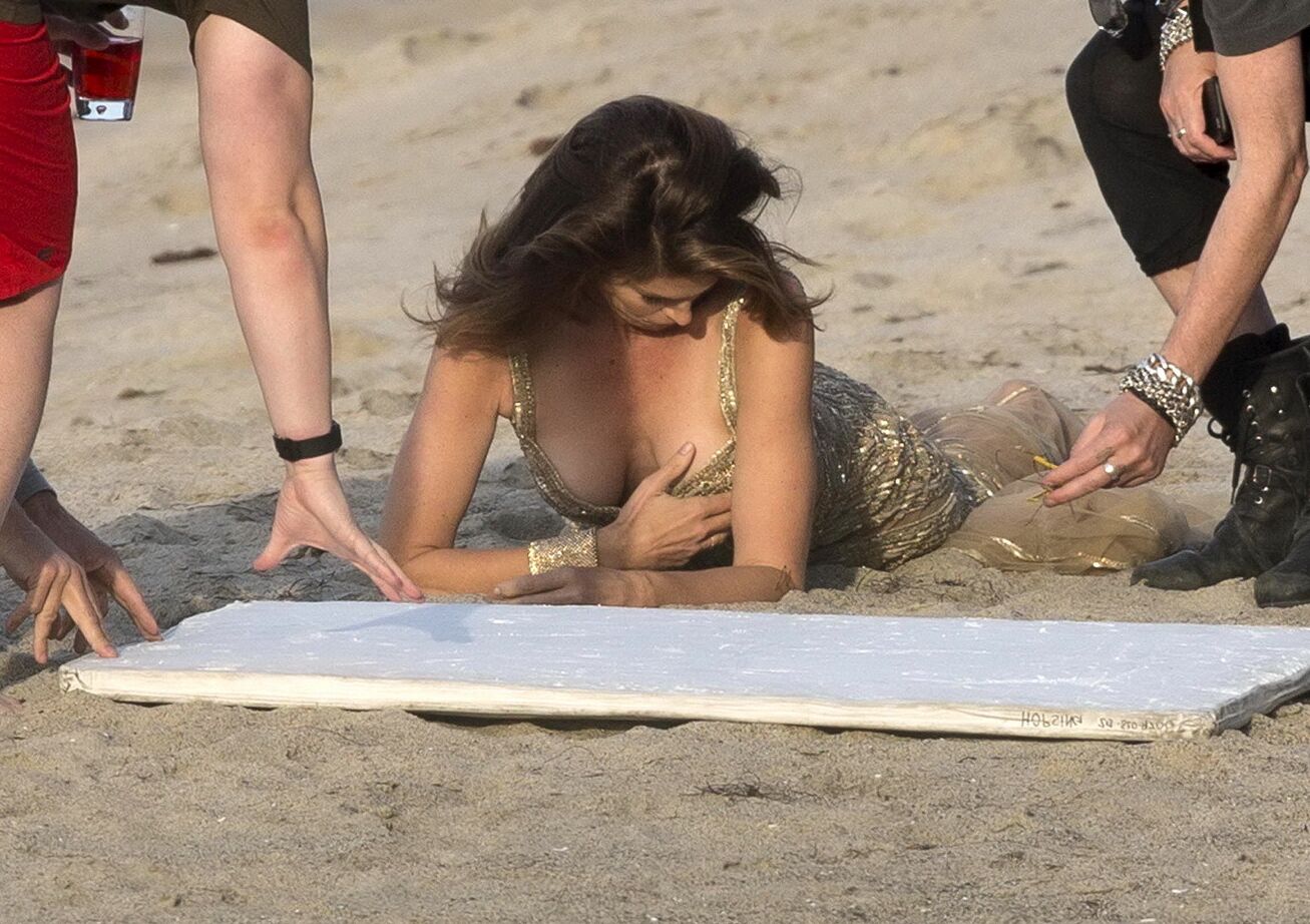 Cindy Crawford braless wearing a see through dress at the photoshoot in Malibu