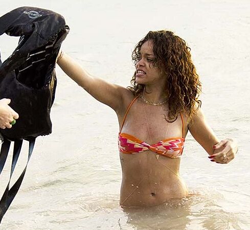 Rihanna posing and showing her sexy ass in bikini on beach