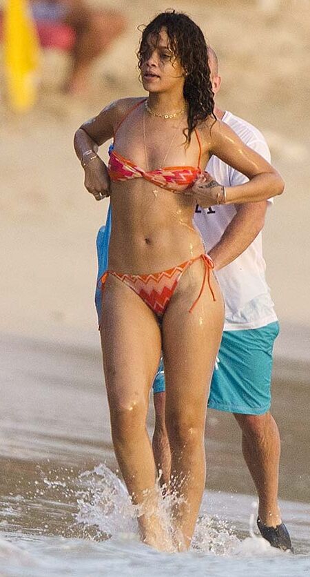 Rihanna posing and showing her sexy ass in bikini on beach