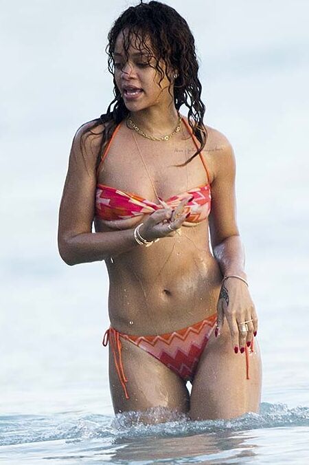 Rihanna posing and showing her sexy ass in bikini on beach