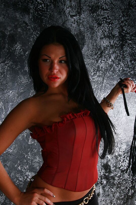 Hot mistress in high-heeled shoes is burning to humiliate that helpless slave