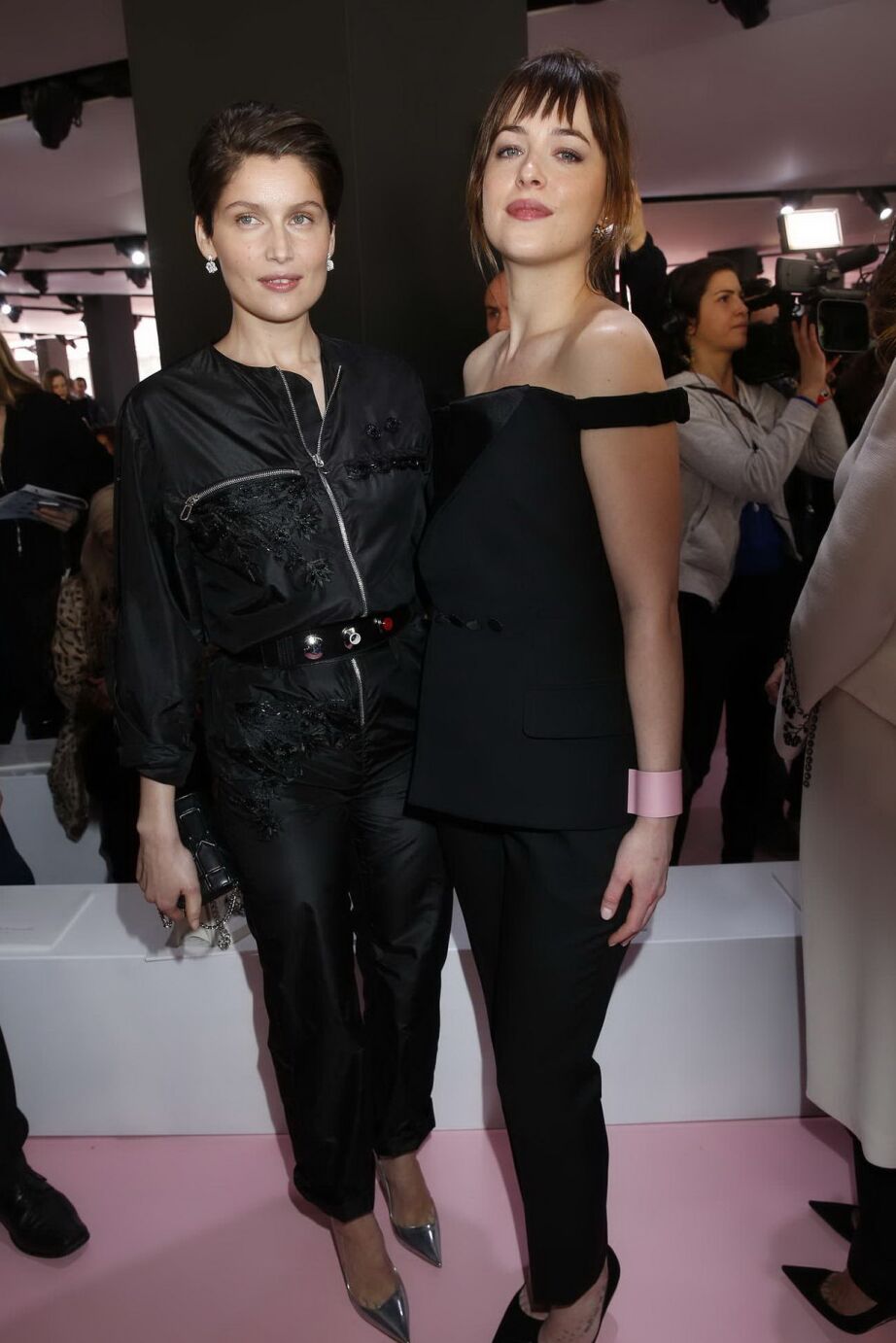 Dakota Johnson showing big cleavage in black jumpsuit at Christian Dior Fashion