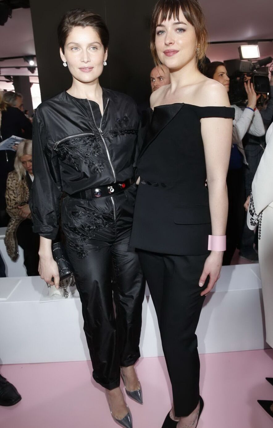 Dakota Johnson showing big cleavage in black jumpsuit at Christian Dior Fashion