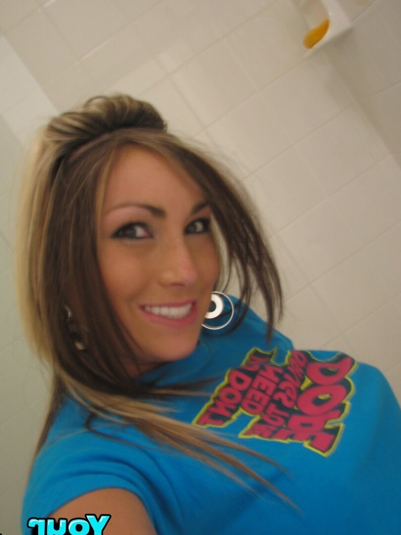 Girlfriend with nice round large breasts take some hot self pics in her house