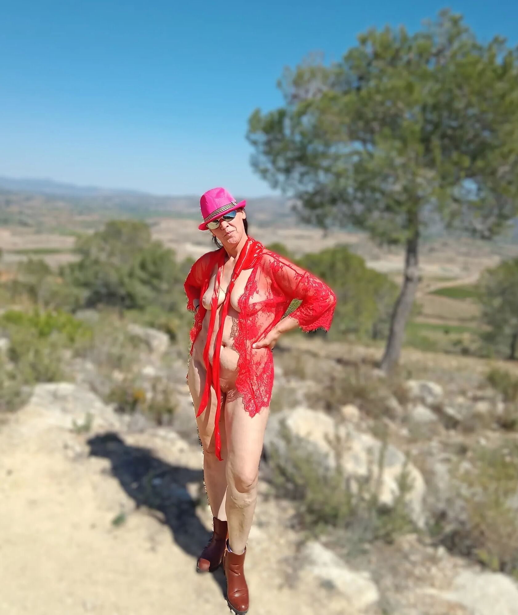 A naked woman on a mountain top - 7 Pics
