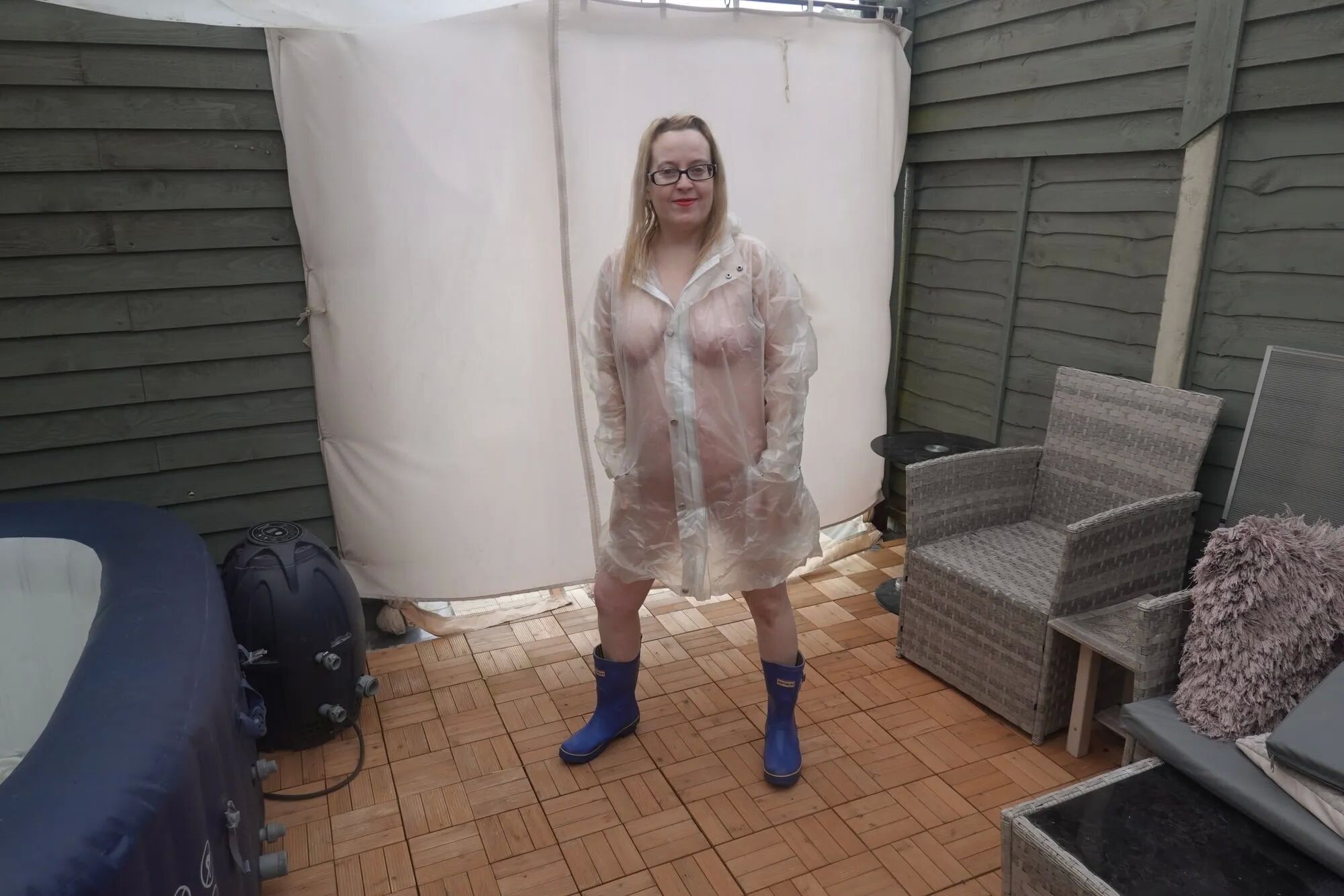 British Tart in transparent plastic Mac and wellingtons - 19 Pics