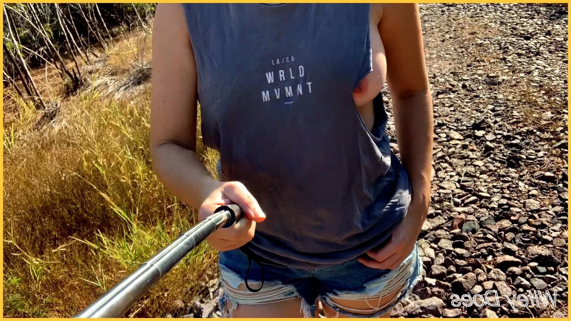 Wifey struts her stuff in a ripped shirt - 14 Pics