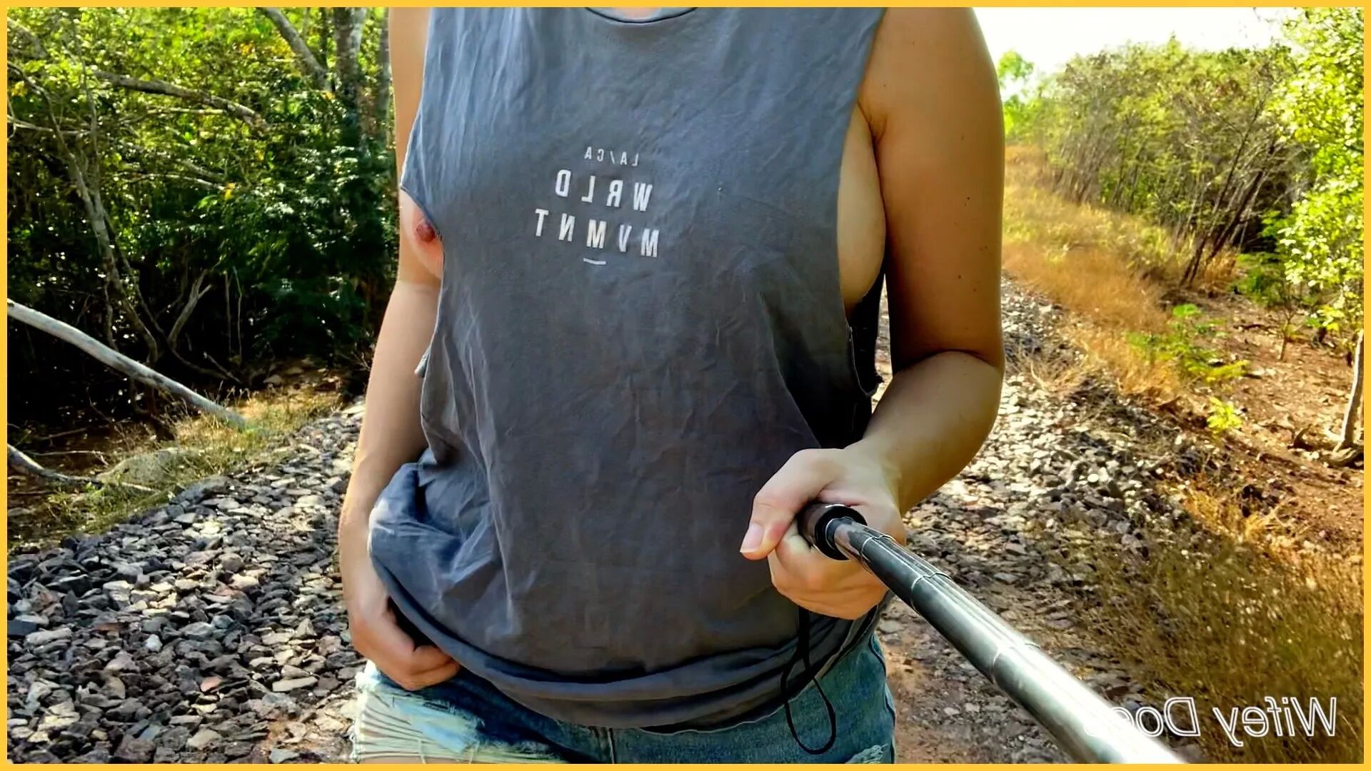 Wifey struts her stuff in a ripped shirt - 14 Pics