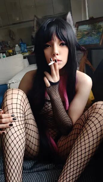 Succubus Babe smoking in fishnets - 26 Pics