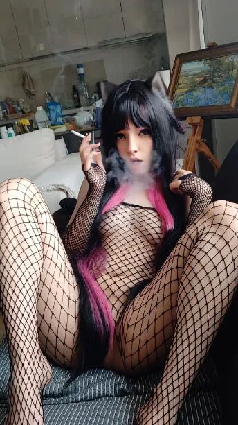 Succubus Babe smoking in fishnets - 26 Pics