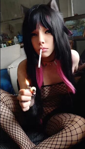 Succubus Babe smoking in fishnets - 26 Pics