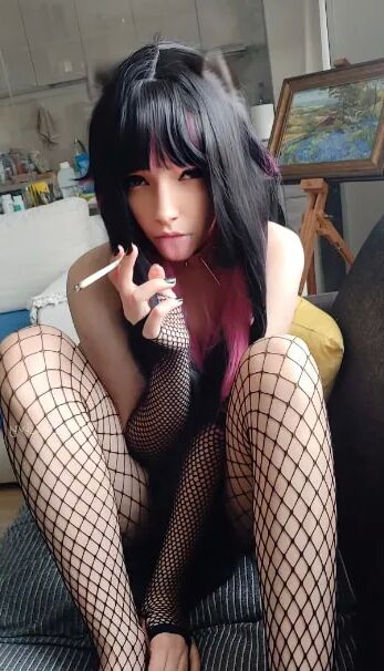Succubus Babe smoking in fishnets - 26 Pics
