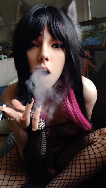 Succubus Babe smoking in fishnets - 26 Pics