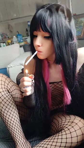 Succubus Babe smoking in fishnets - 26 Pics