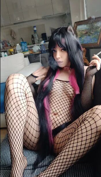 Succubus Babe smoking in fishnets - 26 Pics
