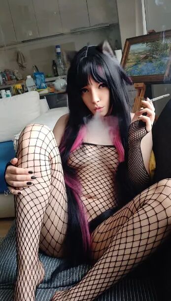 Succubus Babe smoking in fishnets - 26 Pics