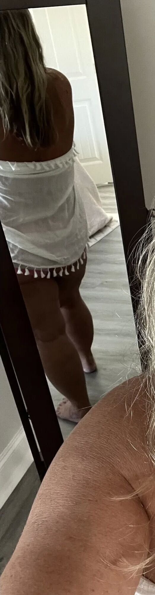 The Real Deal MILF using a sarong to dress up and tease - 10 Pics