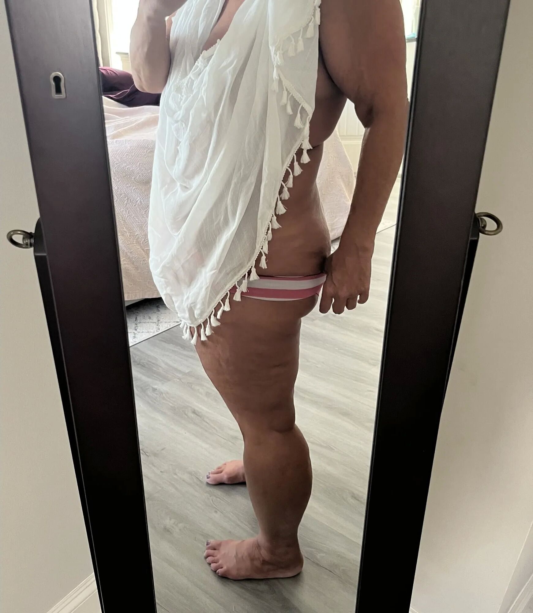 The Real Deal MILF using a sarong to dress up and tease - 10 Pics