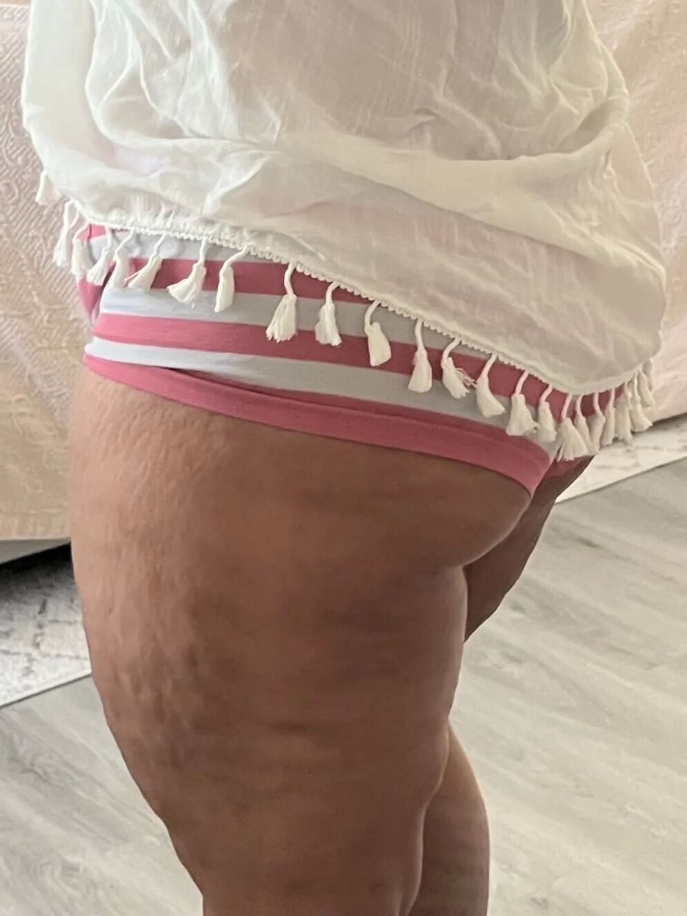 The Real Deal MILF using a sarong to dress up and tease - 10 Pics