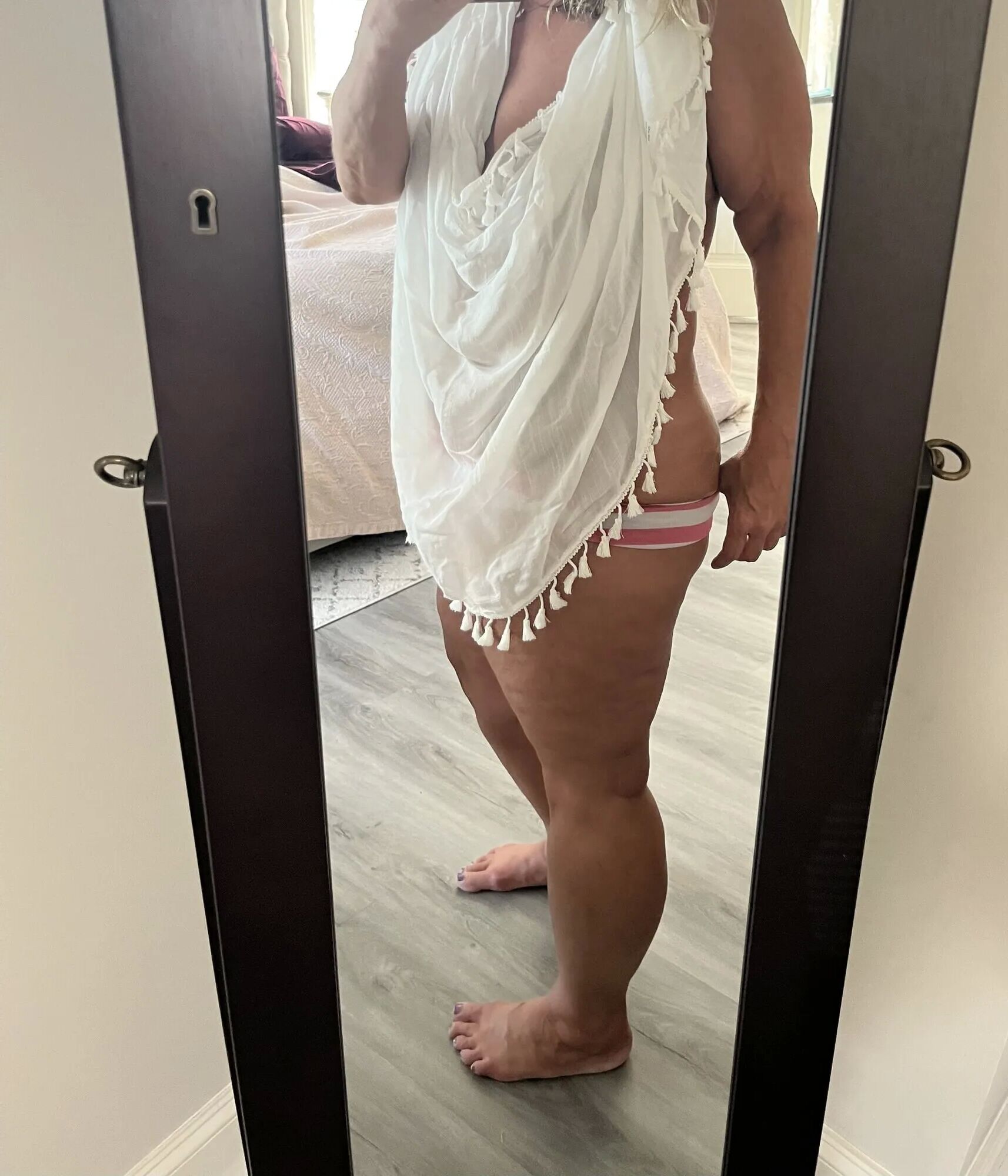 The Real Deal MILF using a sarong to dress up and tease - 10 Pics