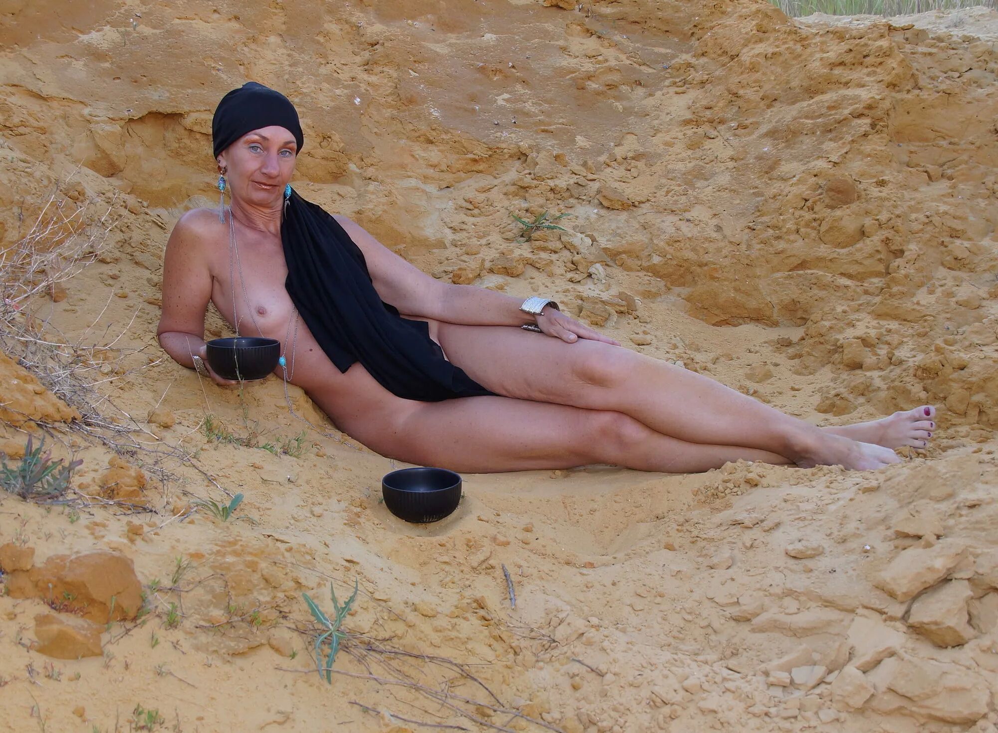 On sand seminude with light-color vase - 35 Pics