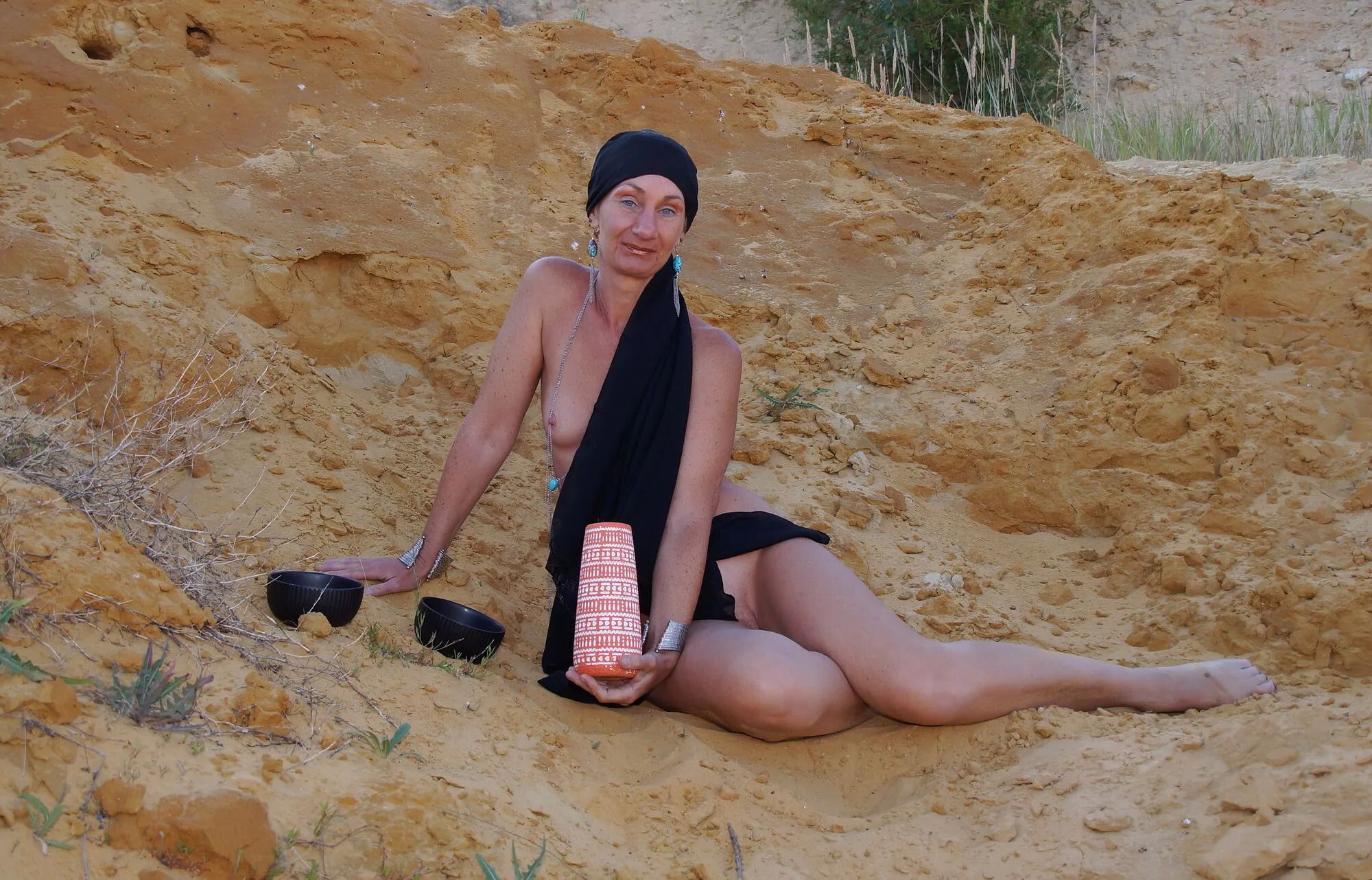 On sand seminude with light-color vase - 35 Pics
