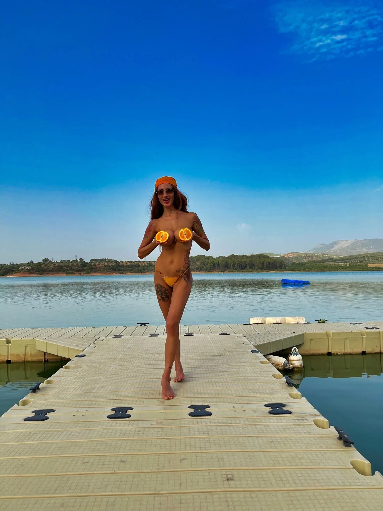 Big boobs tattoed MILF xAmbretta tans in micro bikini - 65 Pics