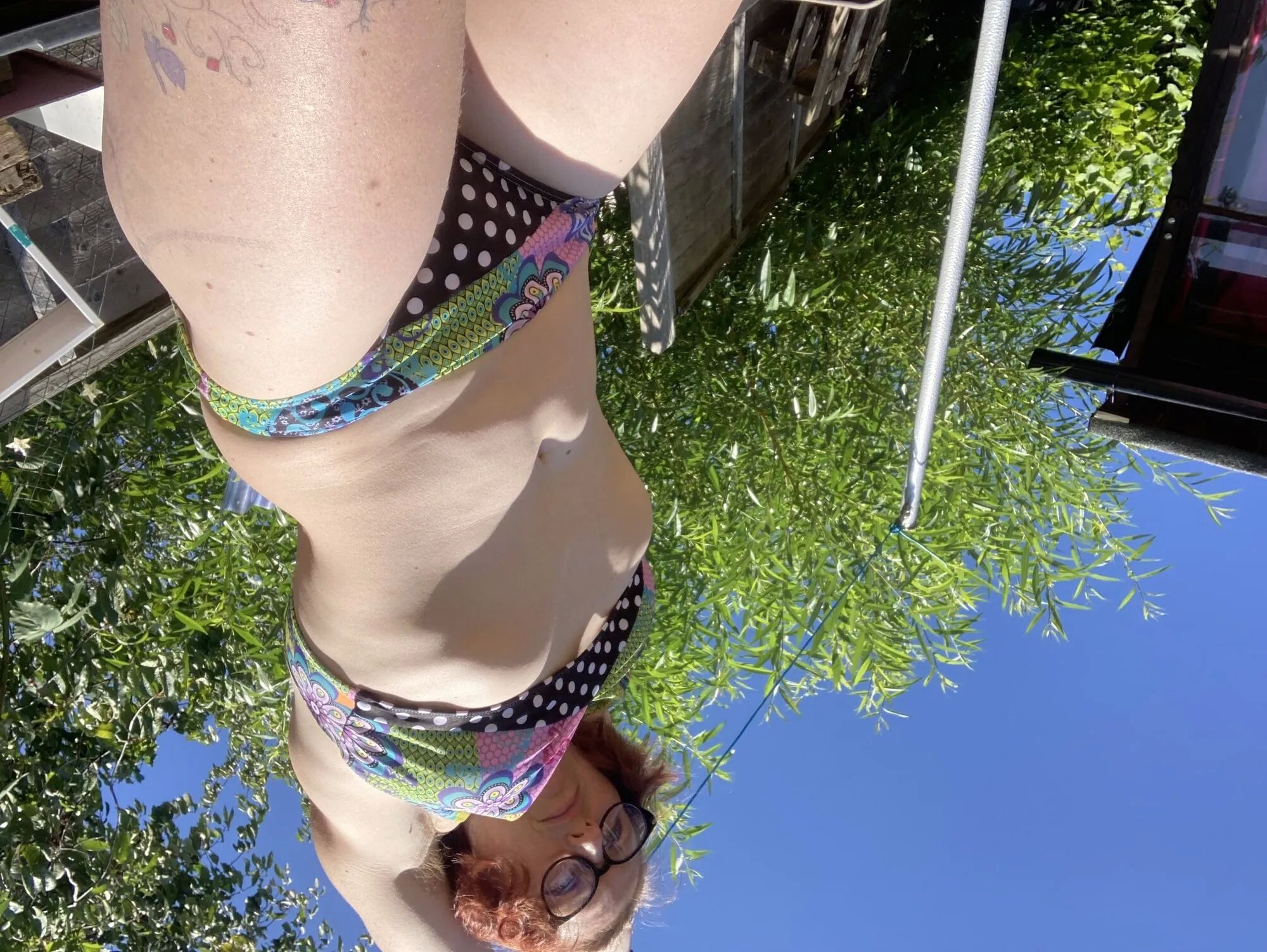 You’re laying in my garden whilst I reach over in a bikini - 25 Pics