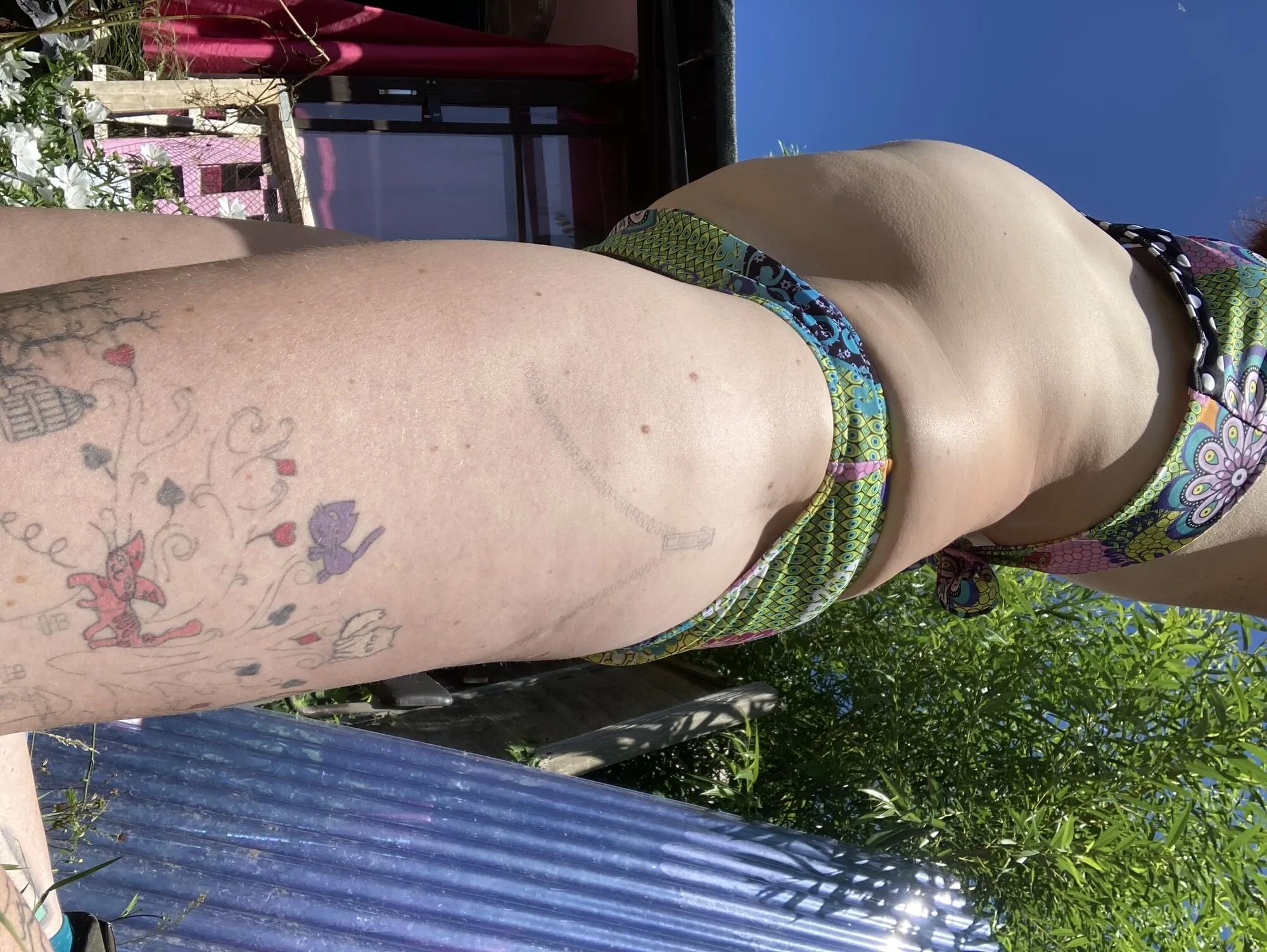 You’re laying in my garden whilst I reach over in a bikini - 25 Pics