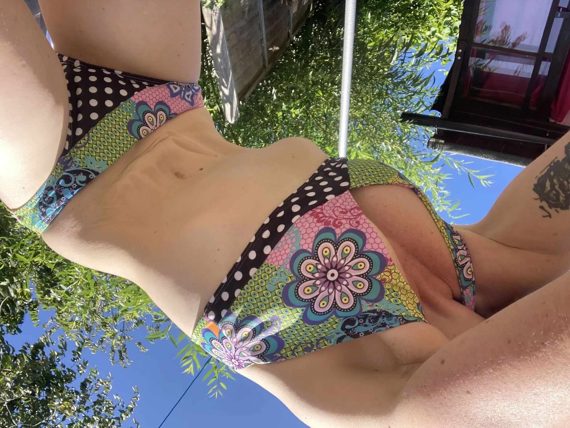 You’re laying in my garden whilst I reach over in a bikini - 25 Pics