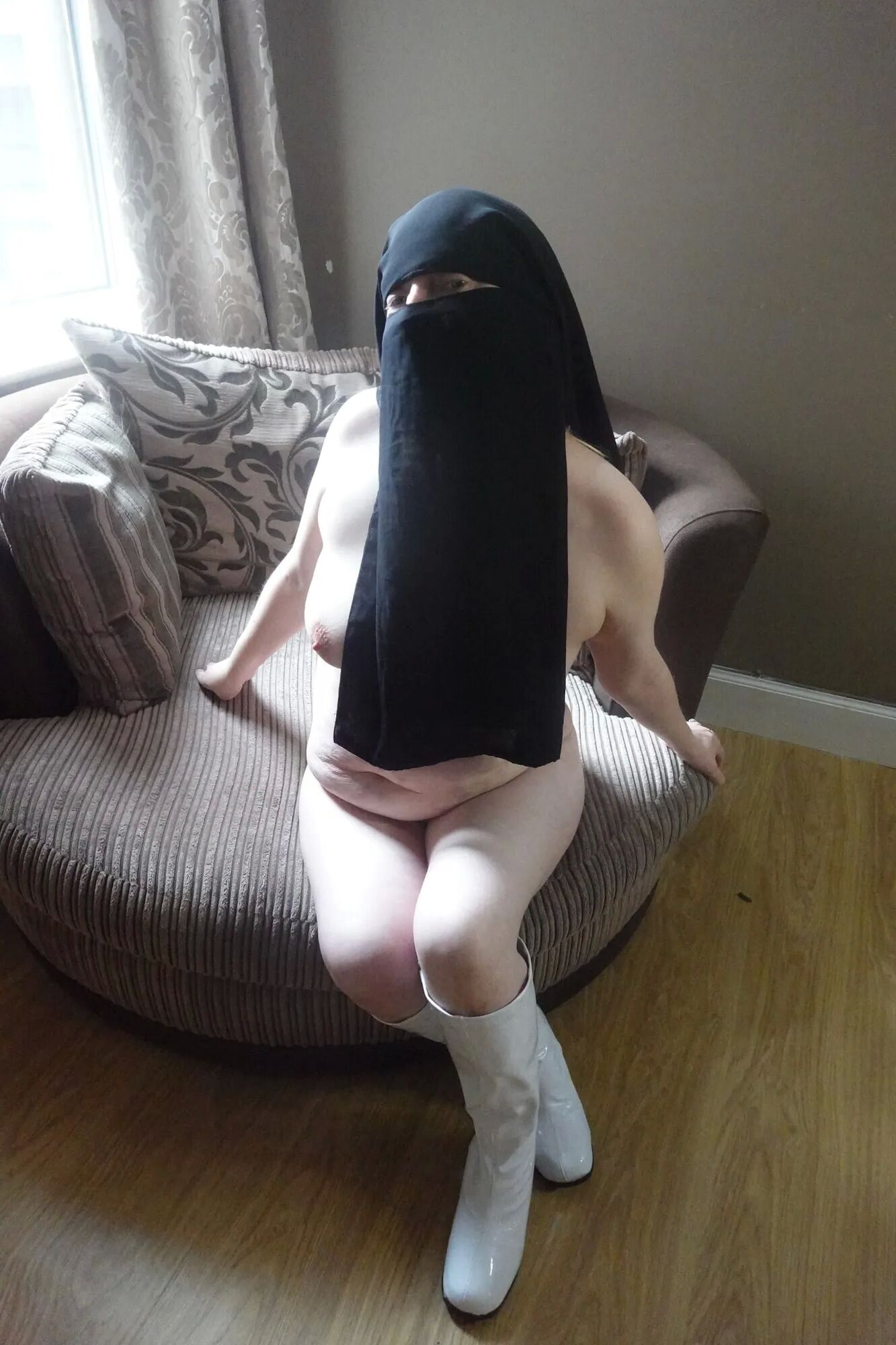 Nude in Niqab and boots - 40 Pics