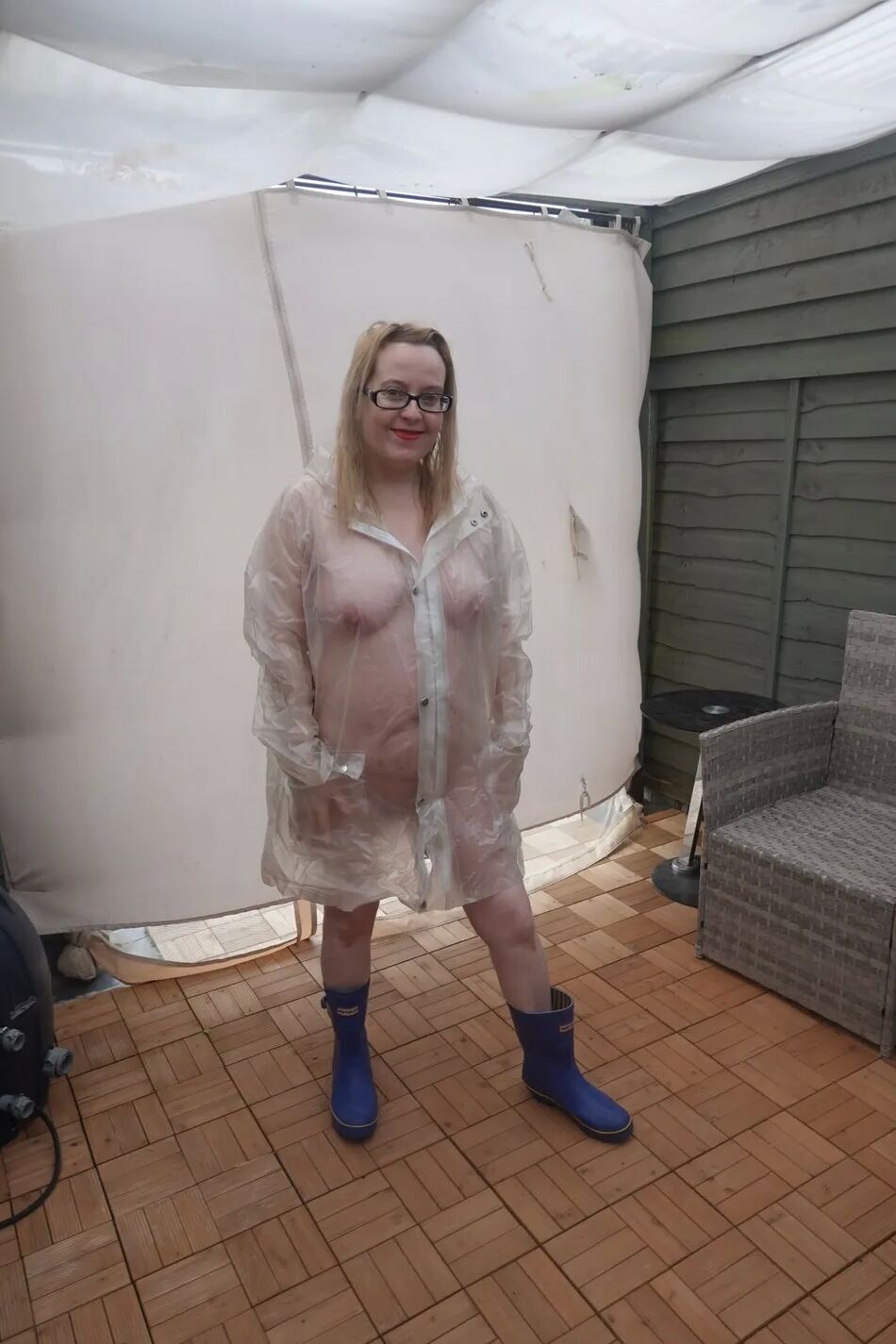 19 Pics British Tart in transparent plastic Mac and wellingtons