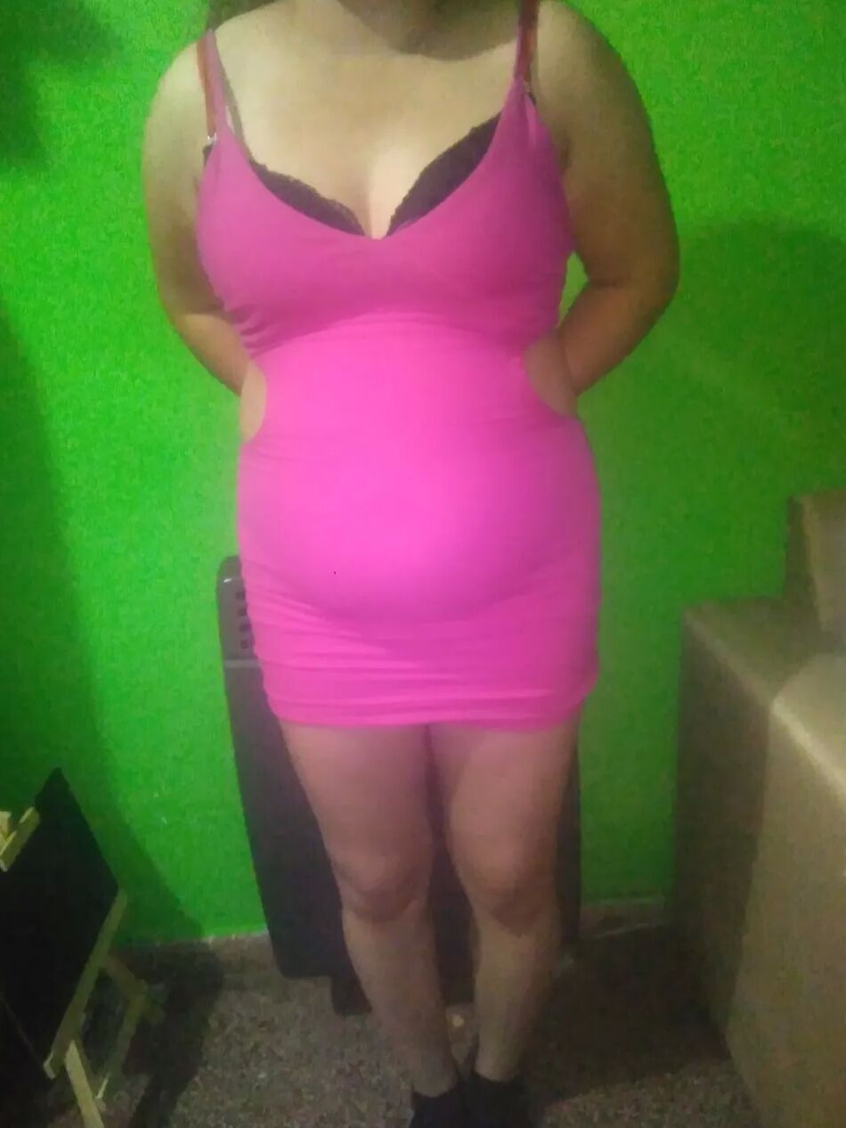 11 Pics Pack 32: She tries on a short pink dress