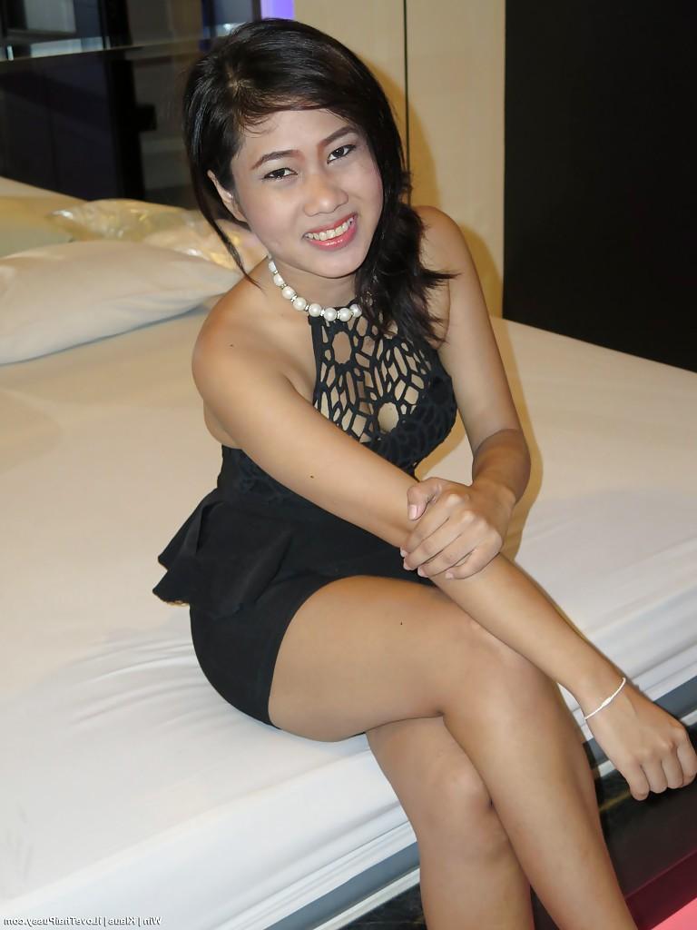 16P Adorable Asian brunette Win getting naked and spreading her pussy