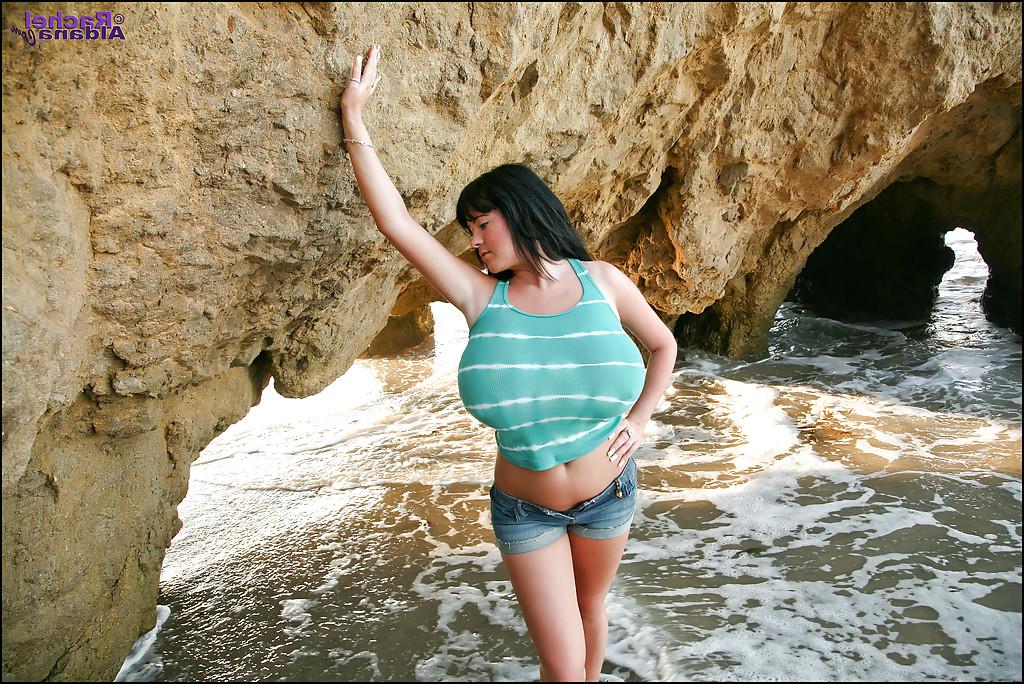 16P Adorable babe in tight jean shorts flashing her big boobs on the beach