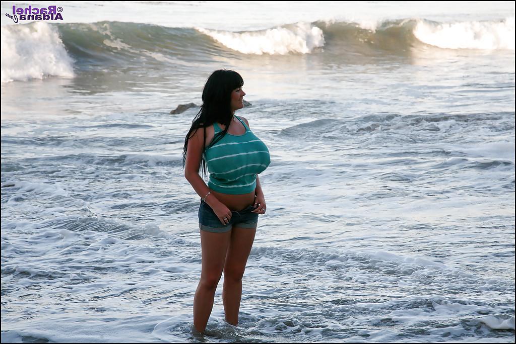16P Adorable babe in tight jean shorts flashing her big boobs on the beach