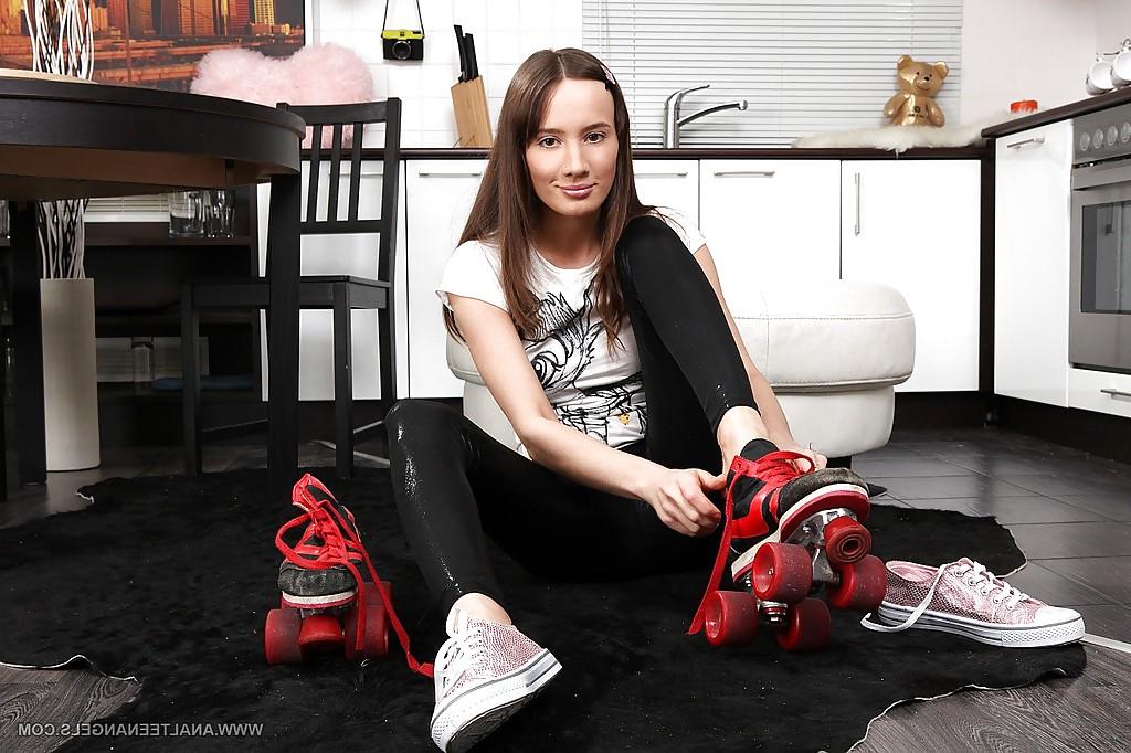 16P Adorable long legged teen girl trying on roller skates
