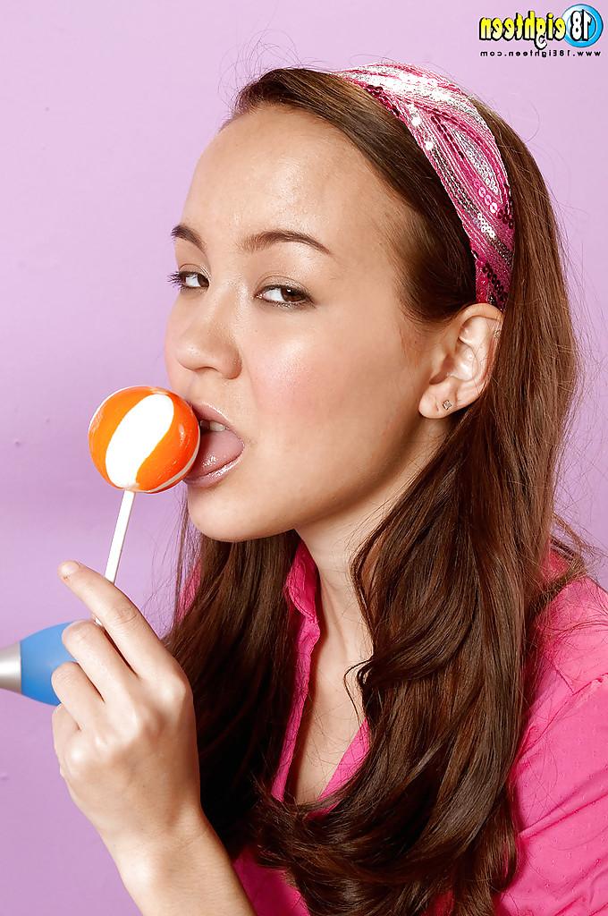 16P Adorable teen girl with small tits Amai Liu posing solo with a lollipop