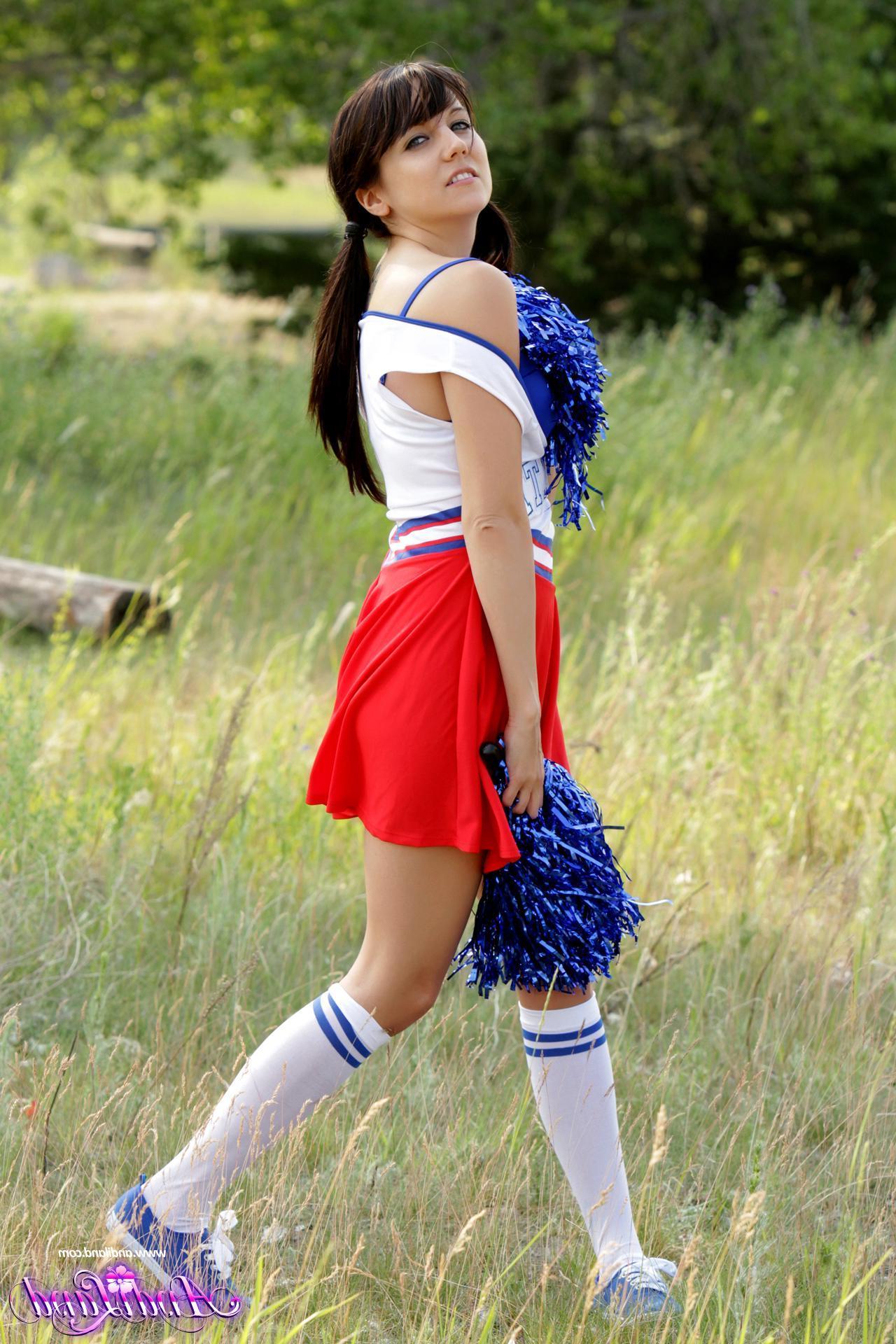 15P Adorable girl Andi flashes her tight pussy and perky tits while cheerleading