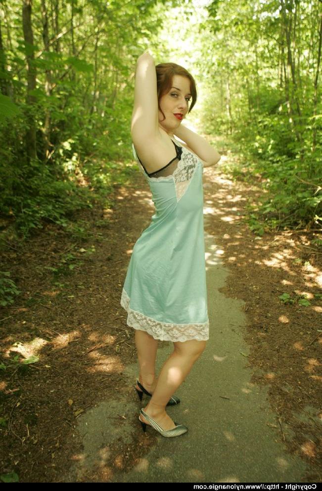 12P Adorable mature babe in stockings showcasing her lingerie outdoor