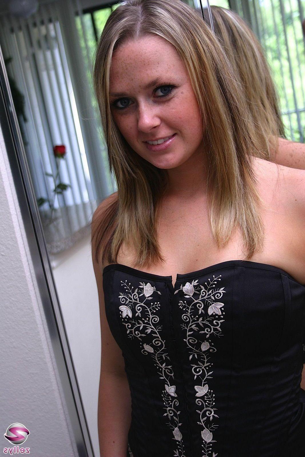 15P Pictures of a cute blonde teen in a corset