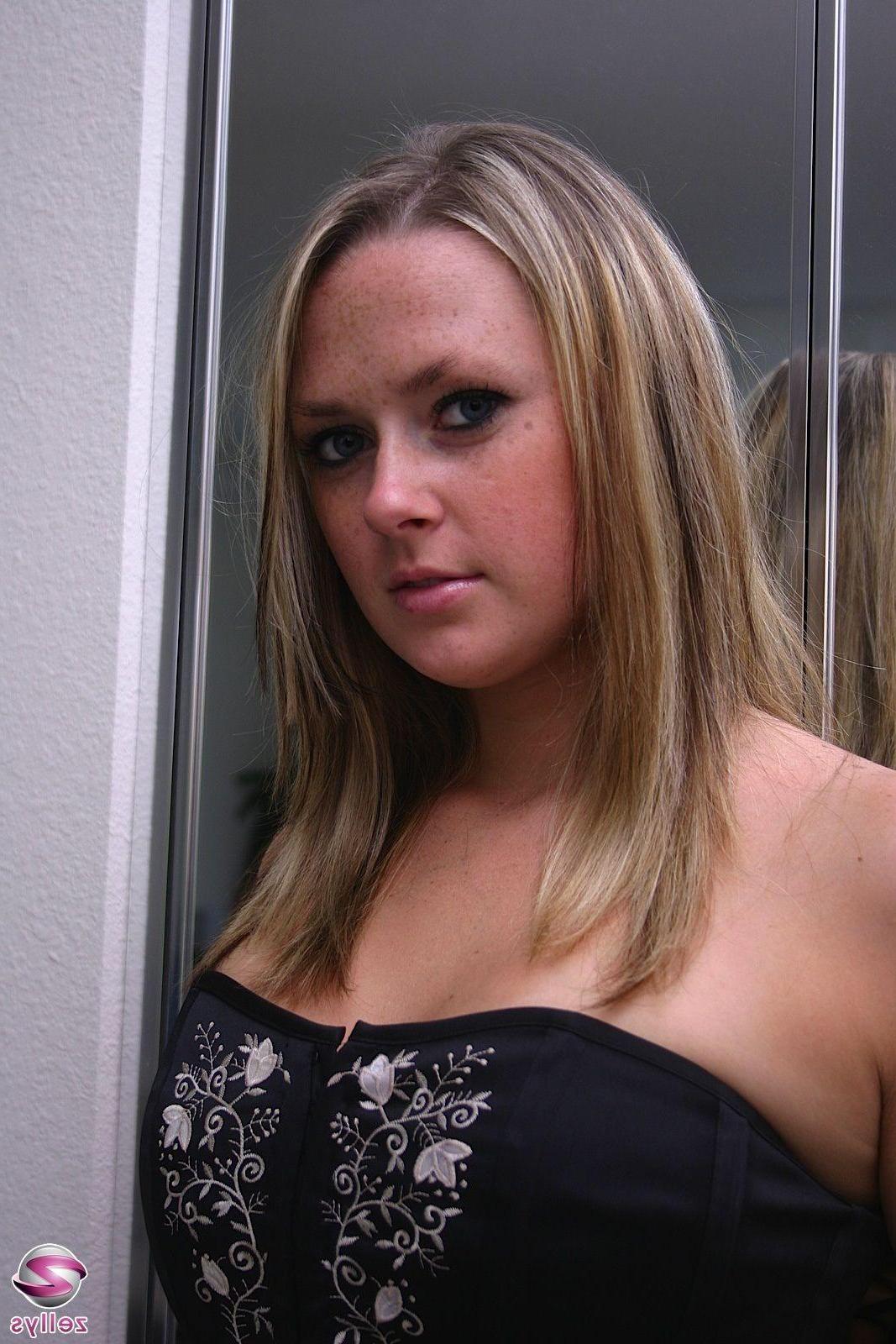 15P Pictures of a cute blonde teen in a corset