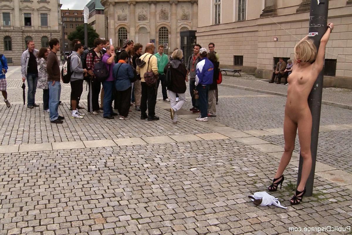 24P European hottie Paris Pink is bound in the middle of a city square and stripped 