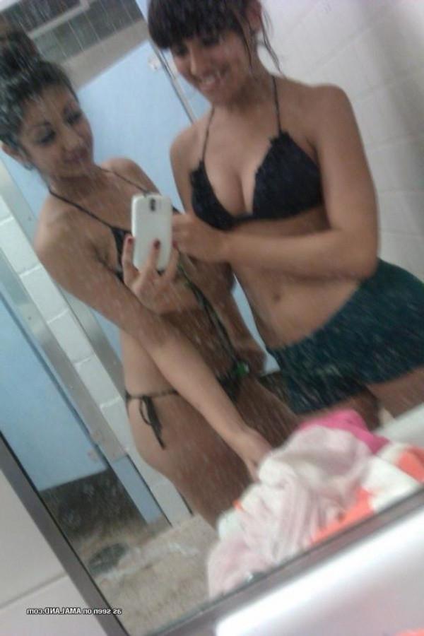 11P Gallery of a lovely brunette teen taking pics with her bff